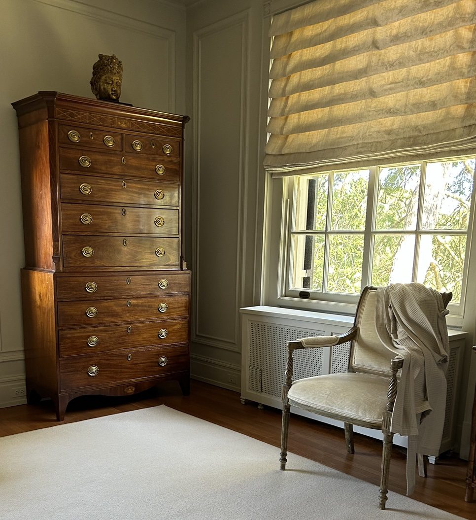 Inside of a room with wooden cabinets and drawers