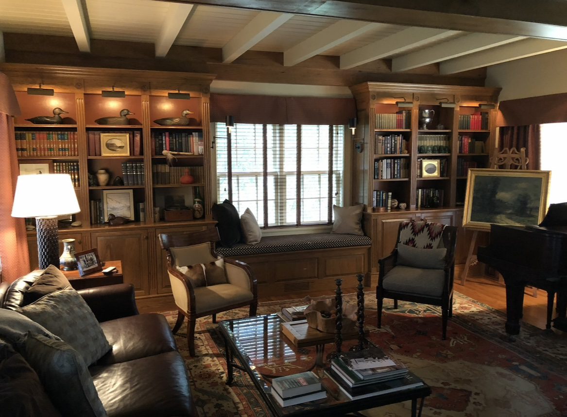 A living room with many chairs and tables