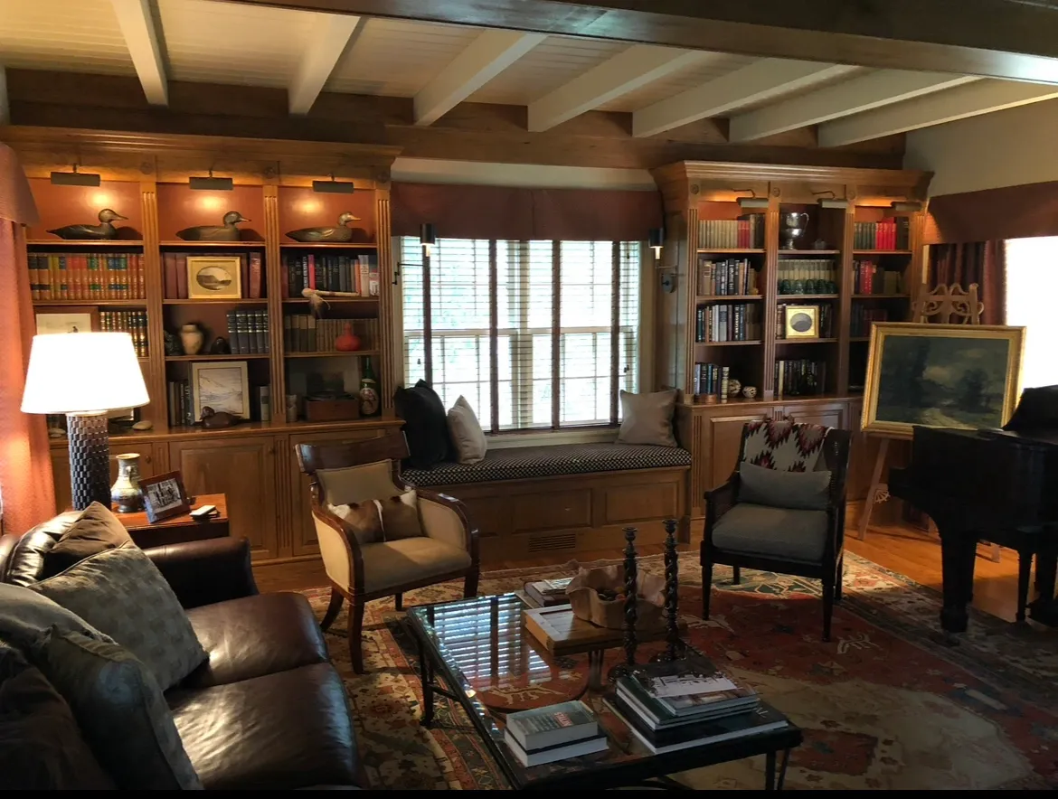 A living room with many chairs and tables